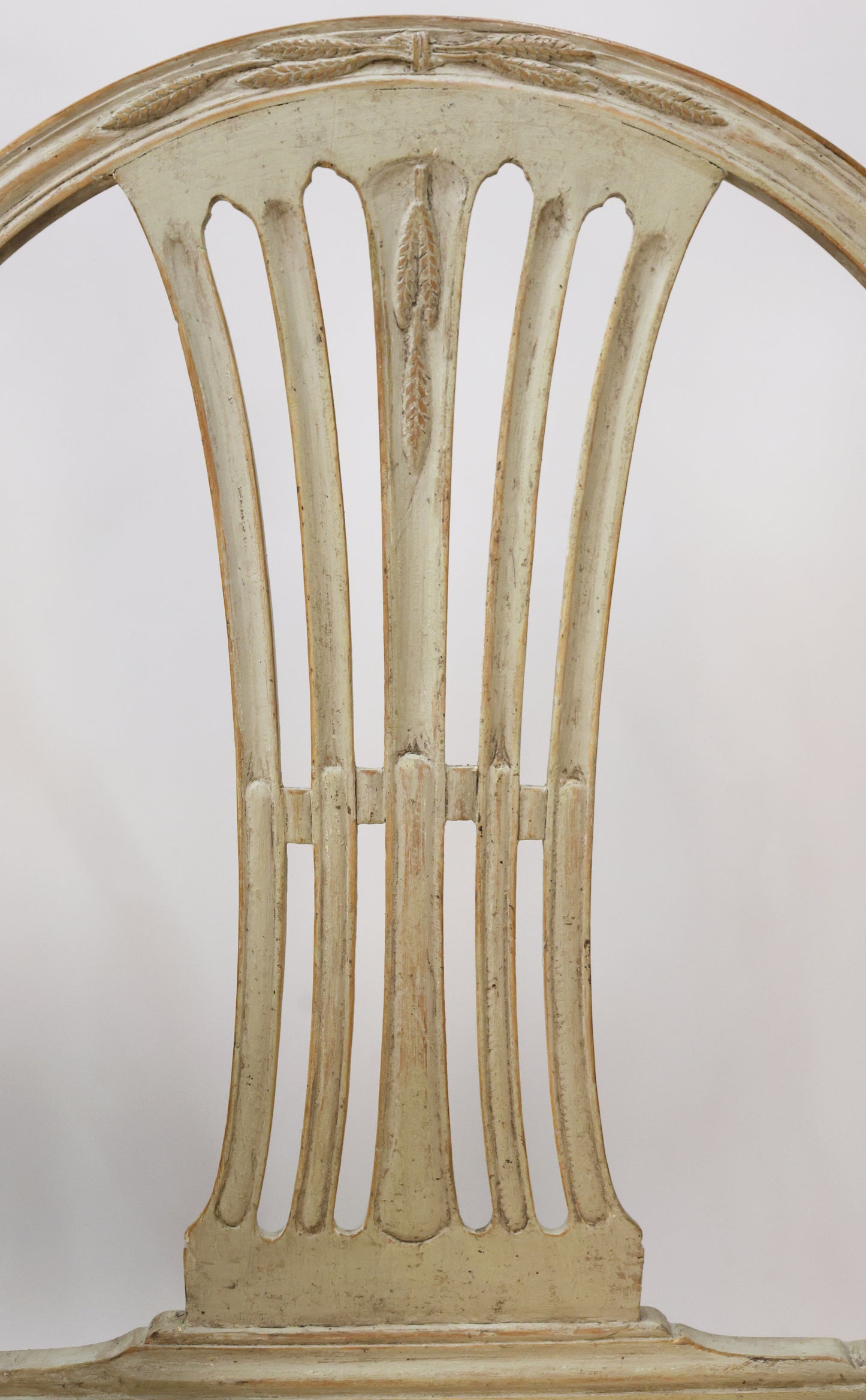 Close up shot of an antique Gustavian armchair.