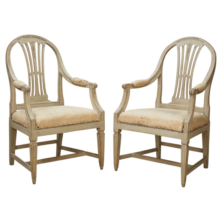 Swedish antique furniture featuring a pair of Gustavian armchairs for sale.