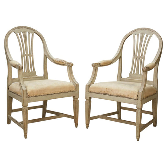 Swedish antique furniture featuring a pair of Gustavian armchairs for sale.