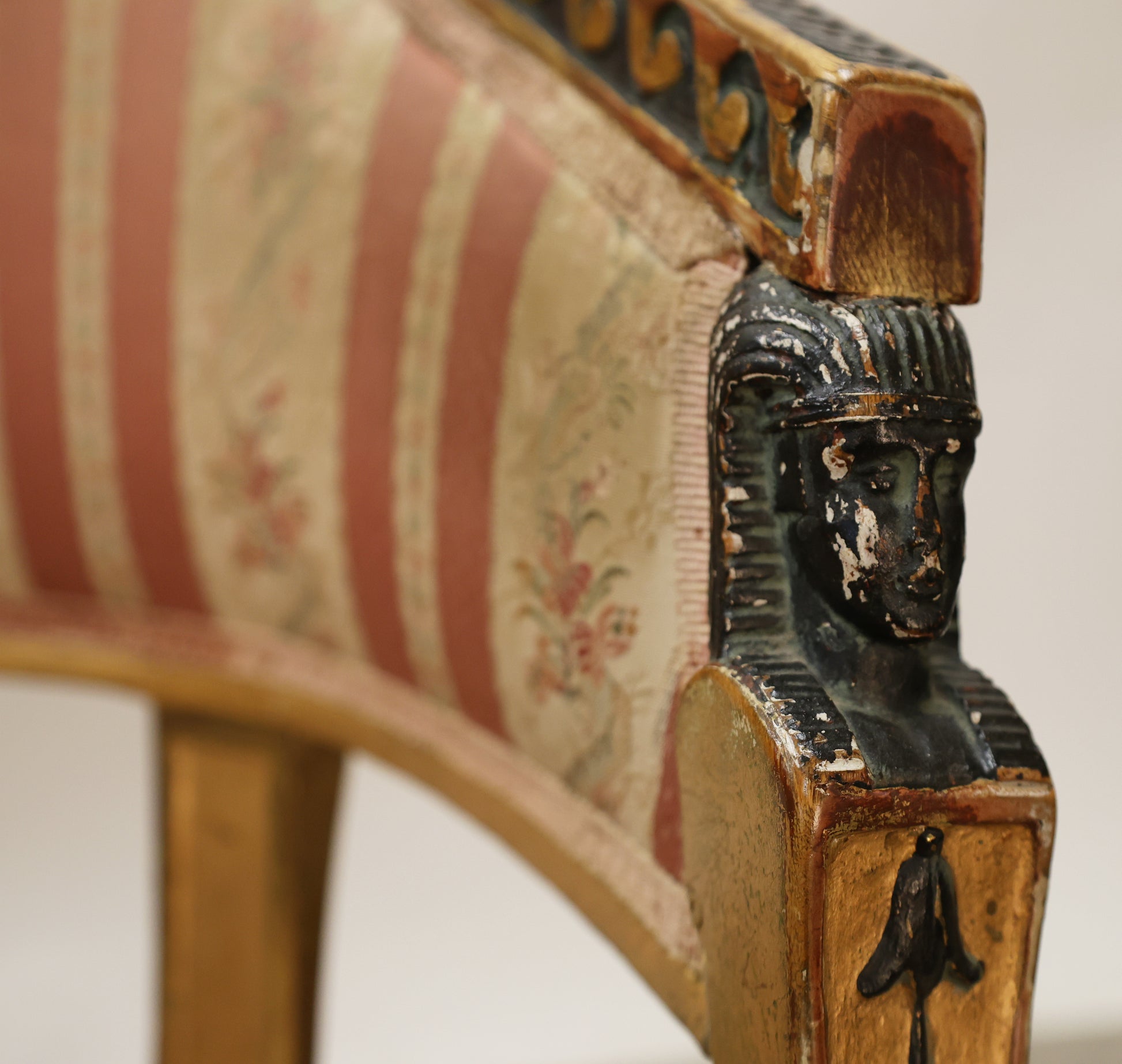 Egyptian head on a Gustavian chair.