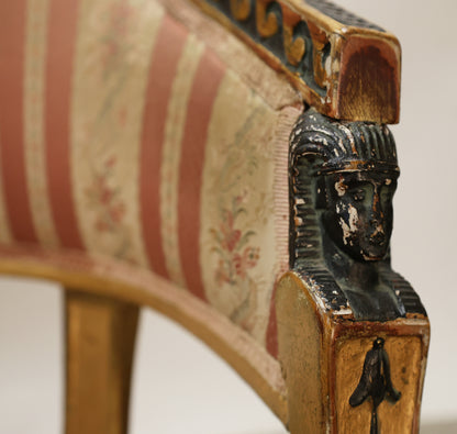 Egyptian head on a Gustavian chair.