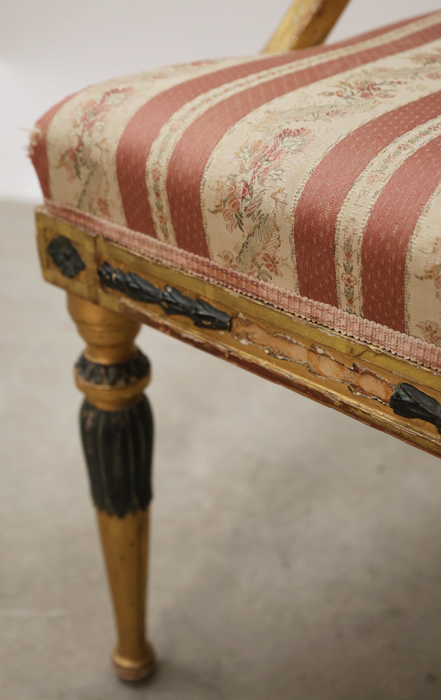 Close-up shot of a Gustavian tub chair.