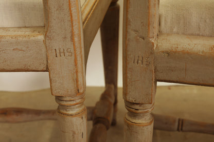 Two antique Gustavian chairs bearing the signatures IHS (Johan Hammarström).