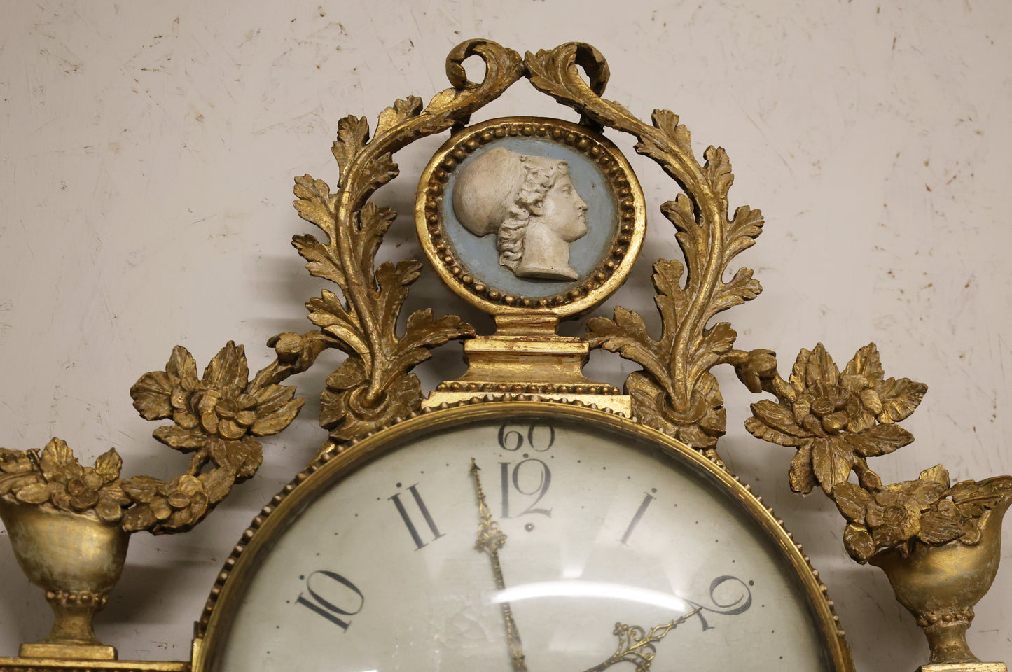 Minerva on an antique wall clock.