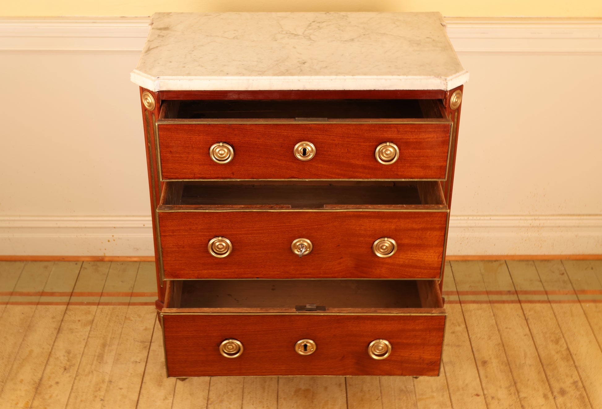 Three drawers on a Gustavian commode.