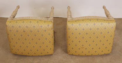 The yellow fabric of a pair of Gustavian stools.