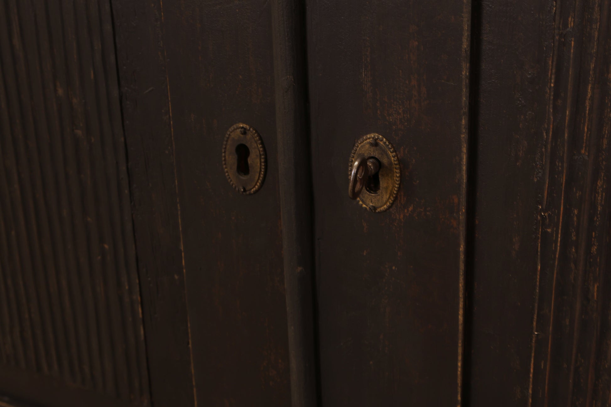 Key to a black antique cabinet.