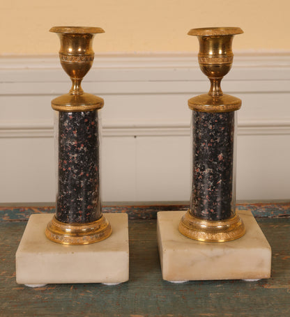 A pair of late gustavian candlesticks for sale.