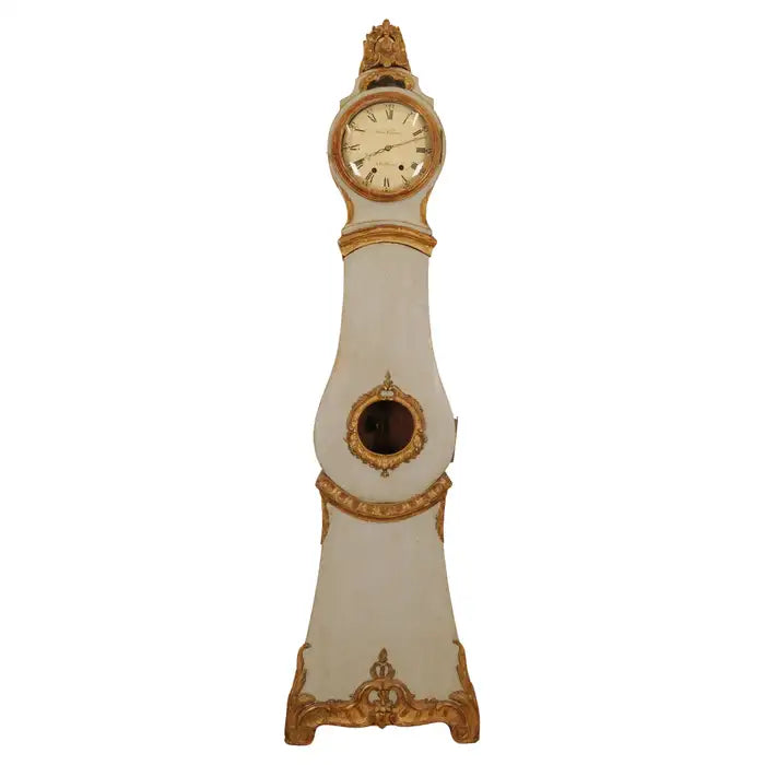 Late 18th Century Rococo Antique Grandfather Clock signed Hans Wessman featuring rich gilded carvings in typical rococo forms with white background.