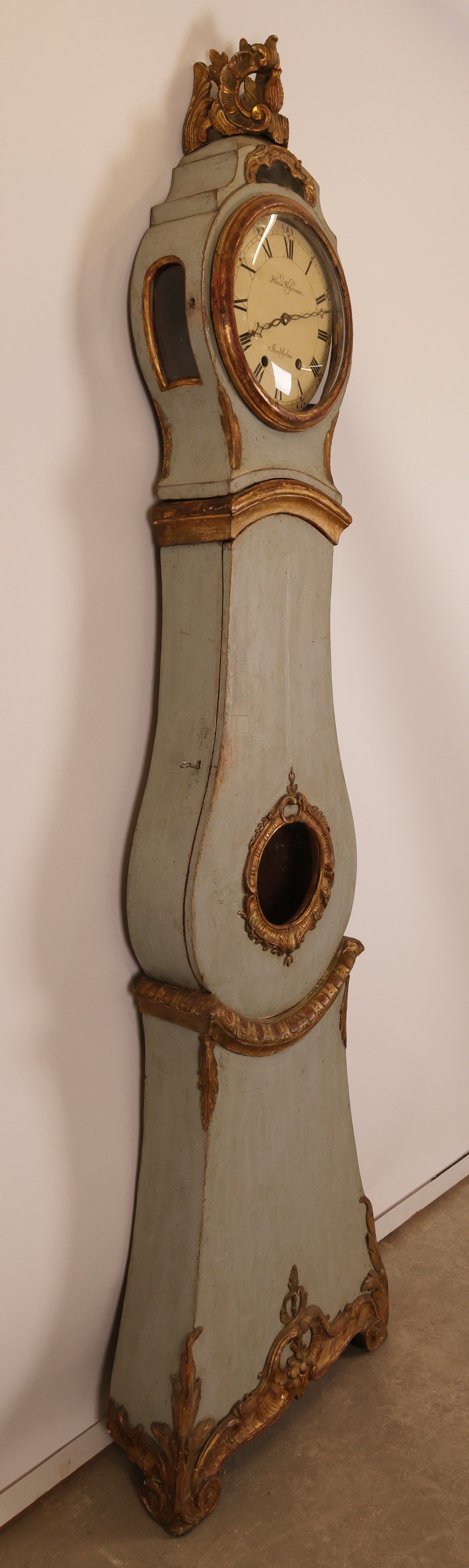 Side view of an 18th Century Rococo Grandfather Clock signed Hans Wessman with rich gilded carvings in typical Rococo forms for sale.