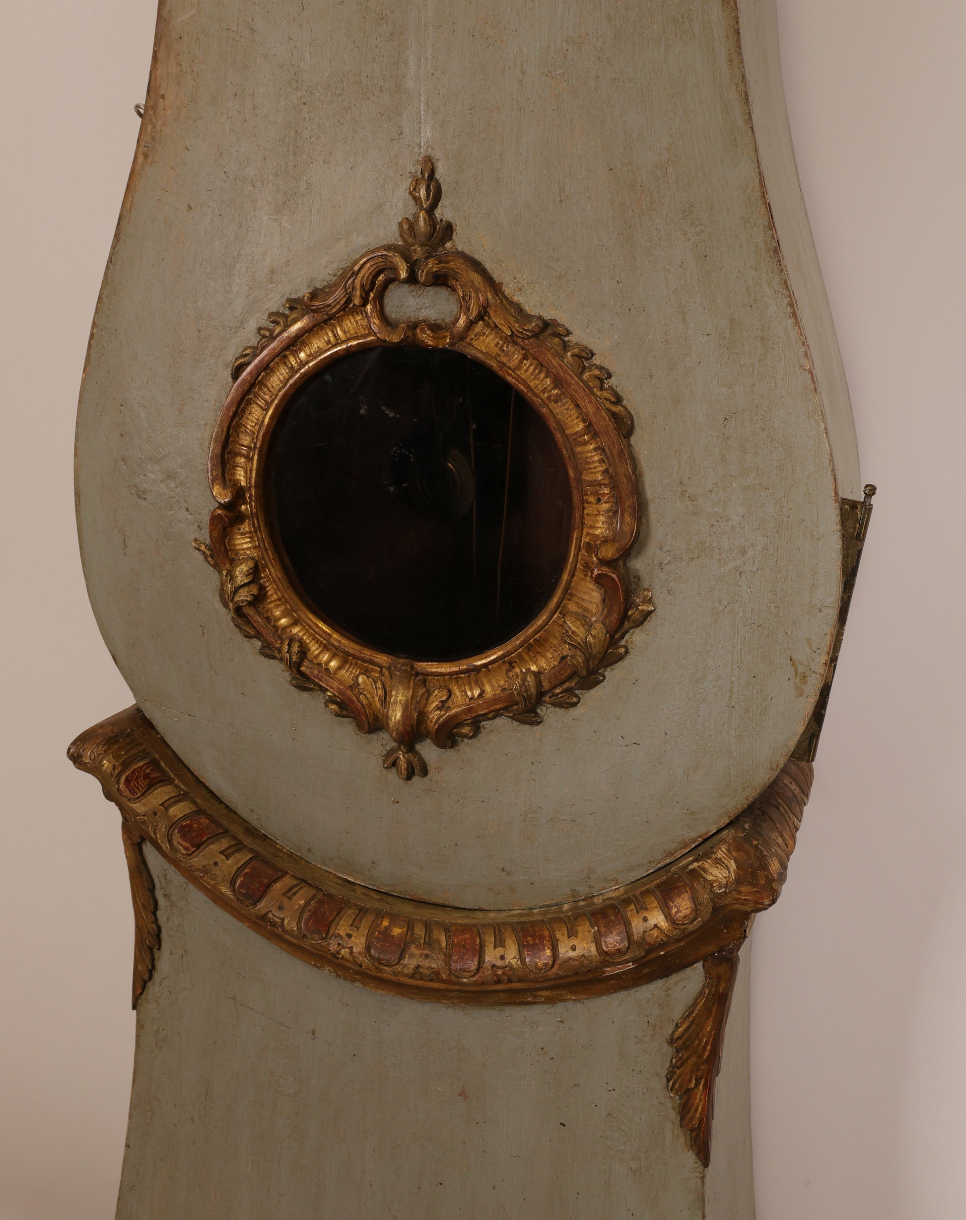 Close up of the body of an 18th Century Rococo Grandfather Clock signed Hans Wessman with rich gilded carvings in typical Rococo forms.