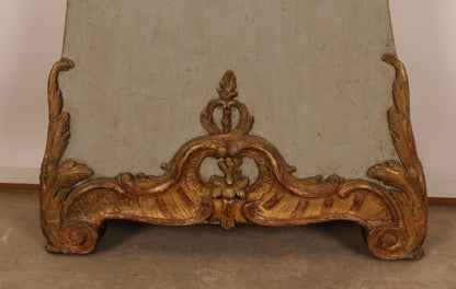Close up of gilded carvings in typical rococo forms on the base of an 18th Century Rococo Longcase Clock signed Hans Wessman.