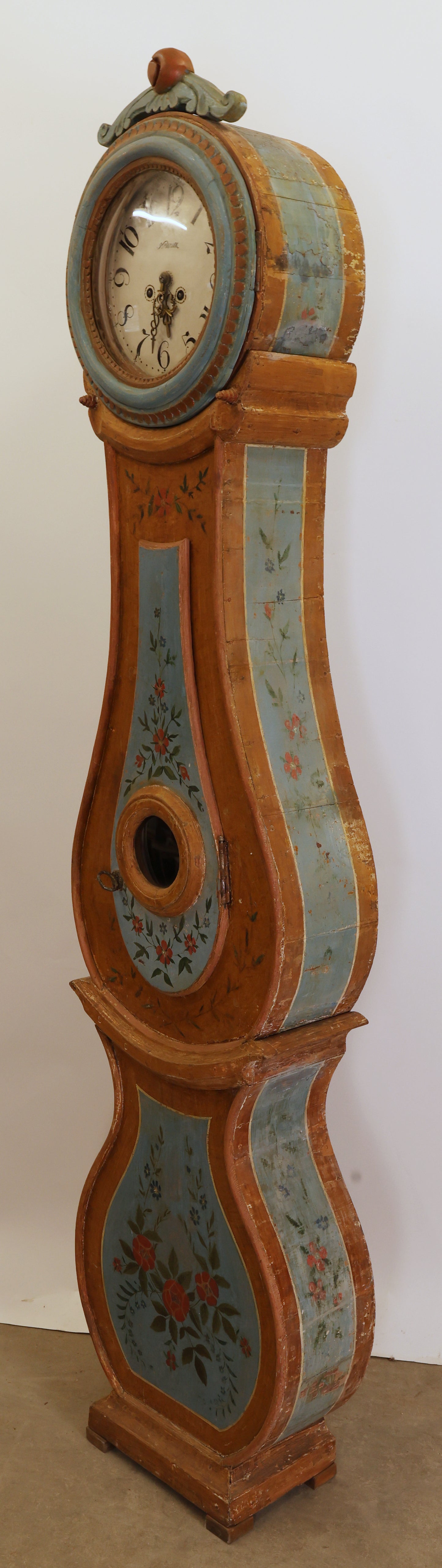 A painted antique grandfather clock.