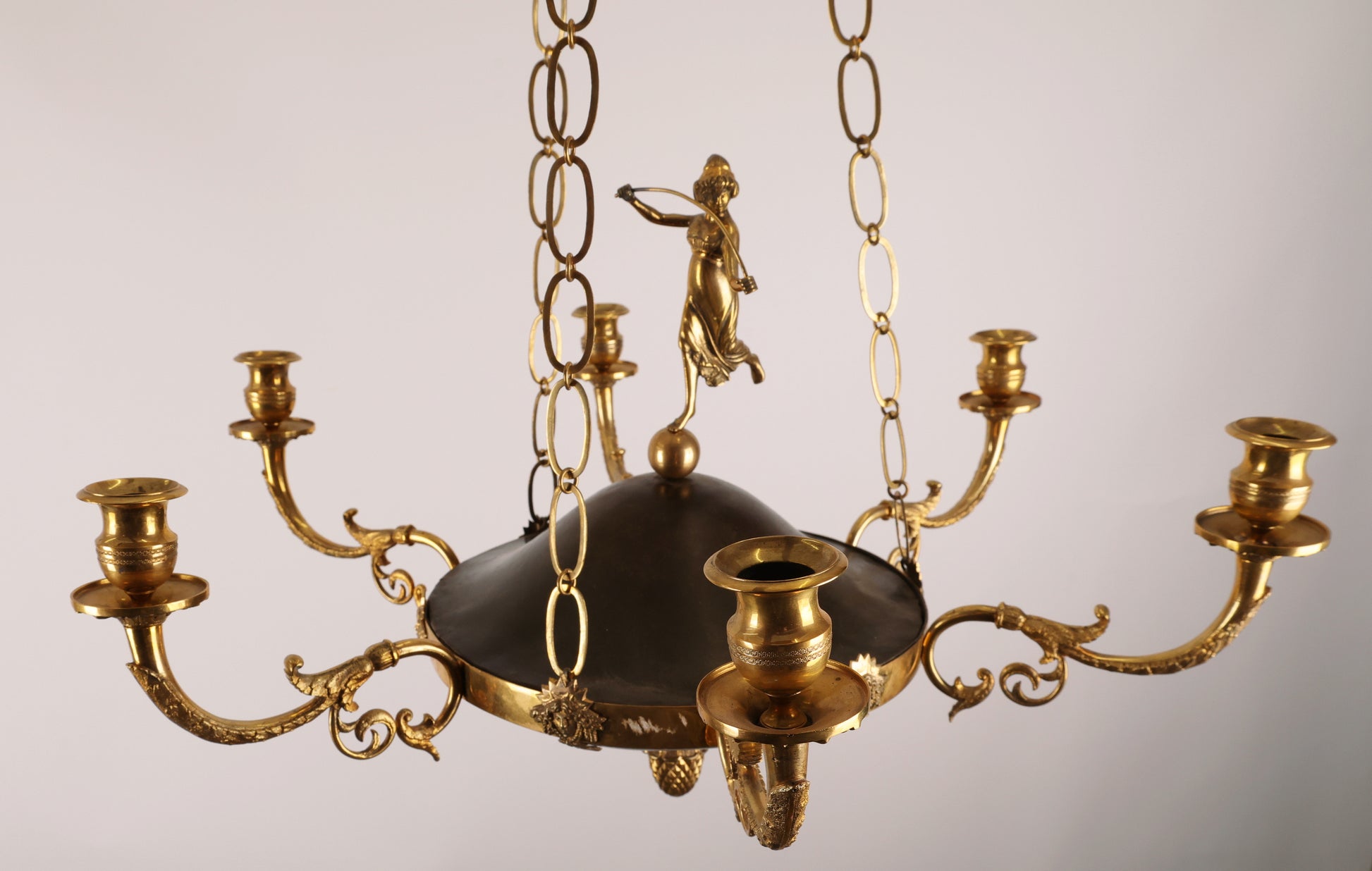 An 19th century empire pendant in fire-gilded bronze.
