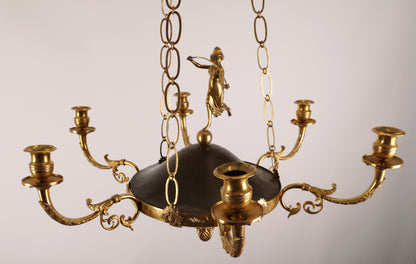 An 19th century empire pendant in fire-gilded bronze.