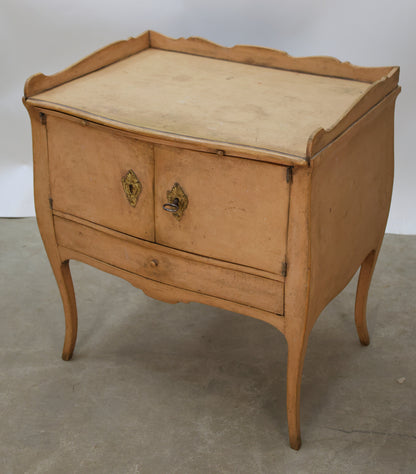 Antique furniture featuring a pink Rococo nightsand