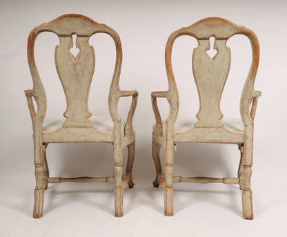 Backview of a pair of 18th century rococo armchairs.