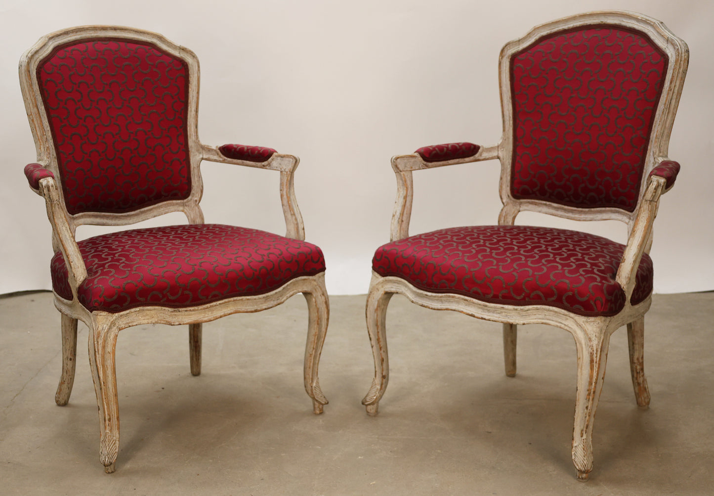 Rococo armchairs with pink upholstery.