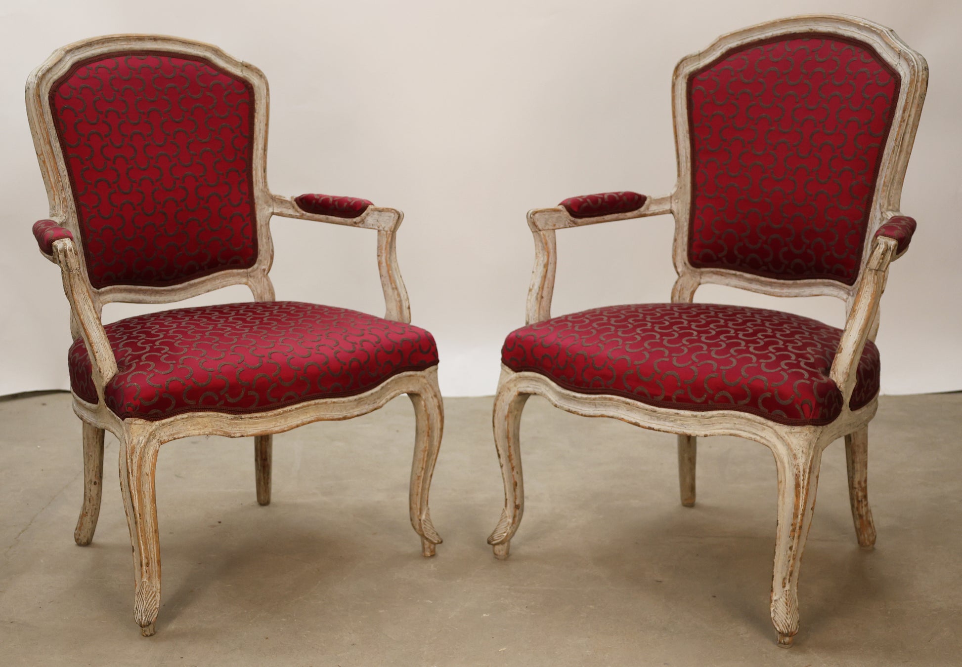 Rococo armchairs with pink upholstery.