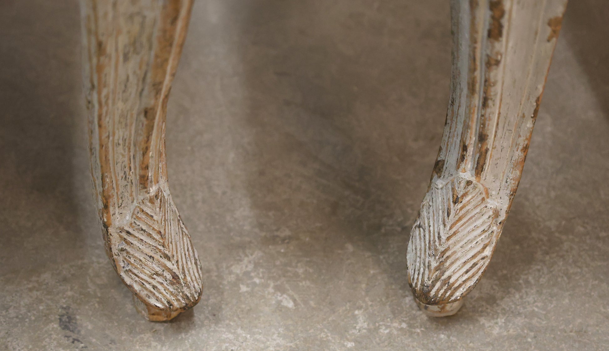 Carved details on a pair of Rococo armchairs.