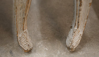 Carved details on a pair of Rococo armchairs.