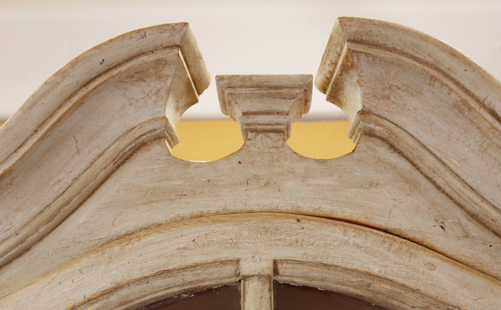 The crown of a Rococo corner cabinet.