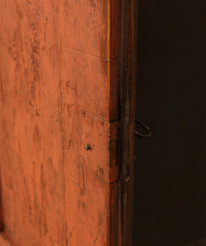A detail on the door of a Rococo cabinet.