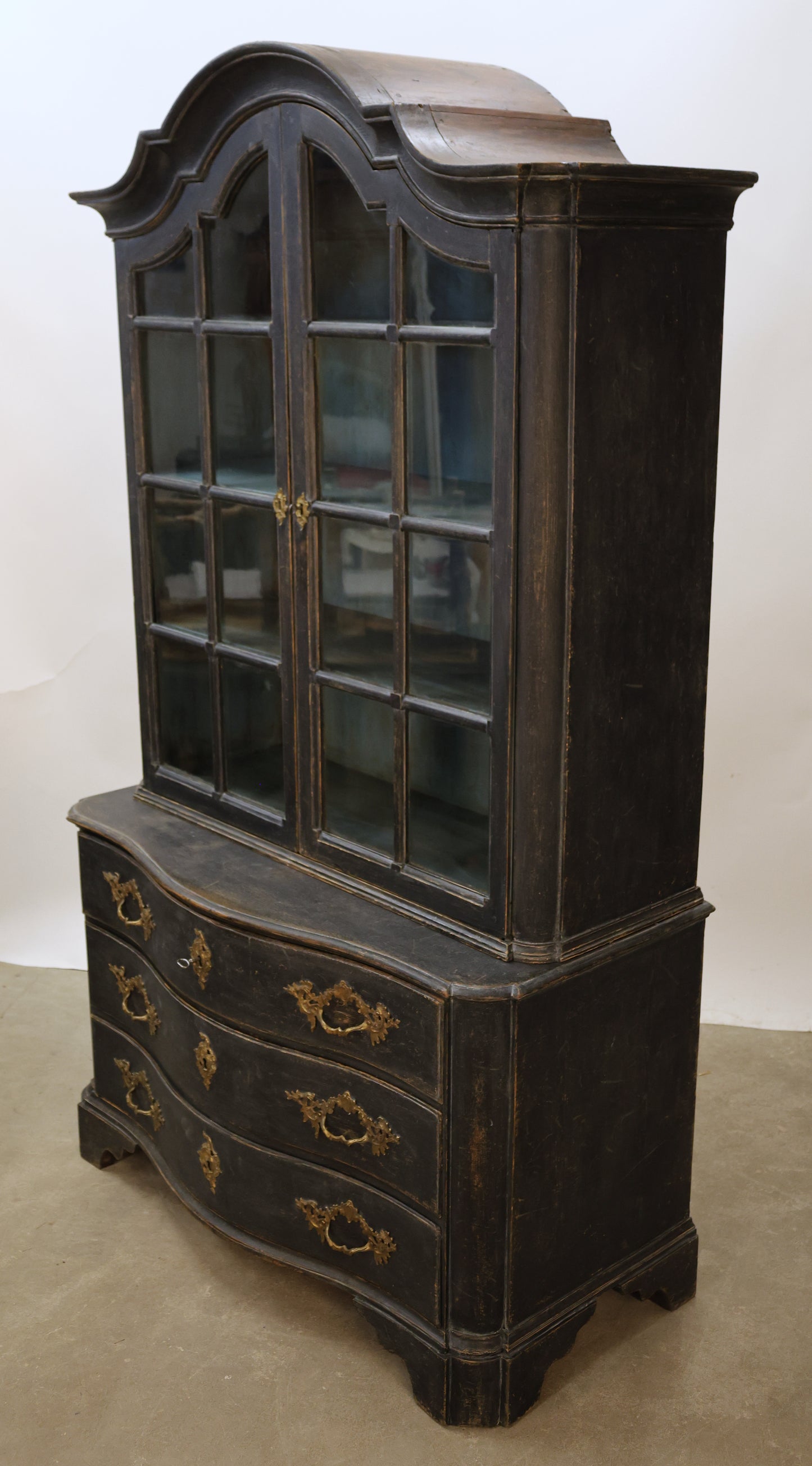A black Rococo display cabinet featured in a selection of Rococo furniture.