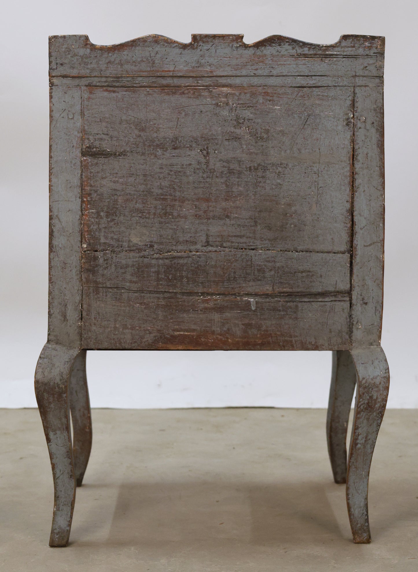 Back view of a blue Rococo nightstand.