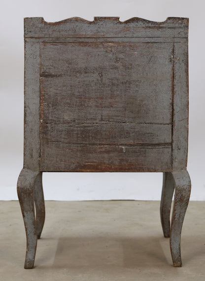 Back view of a blue Rococo nightstand.