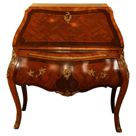A Rococo secretary by Eisenbletter. Veneered in jacaranda, amaranth, and plum wood.