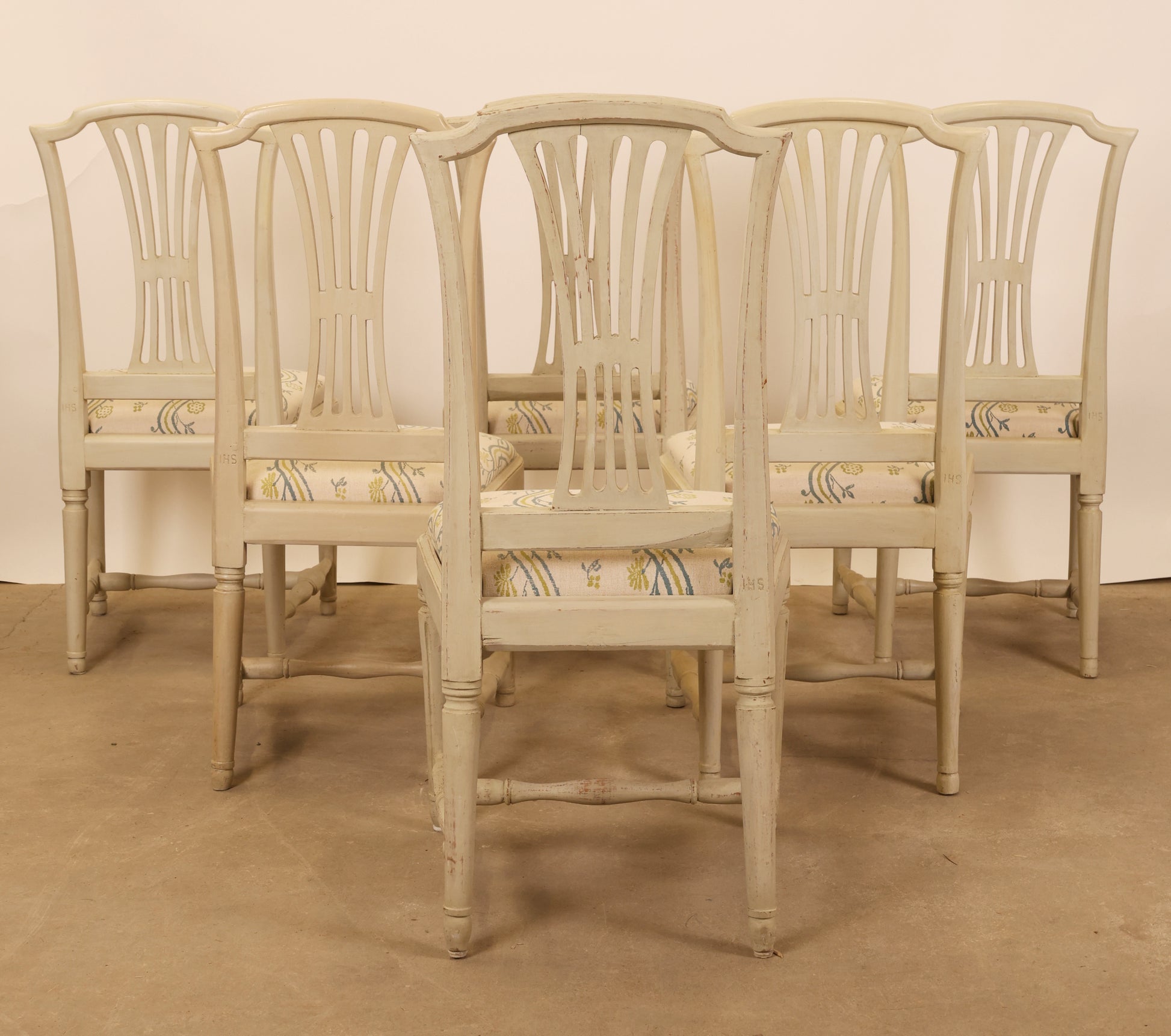 Backview of six gustavian chairs.