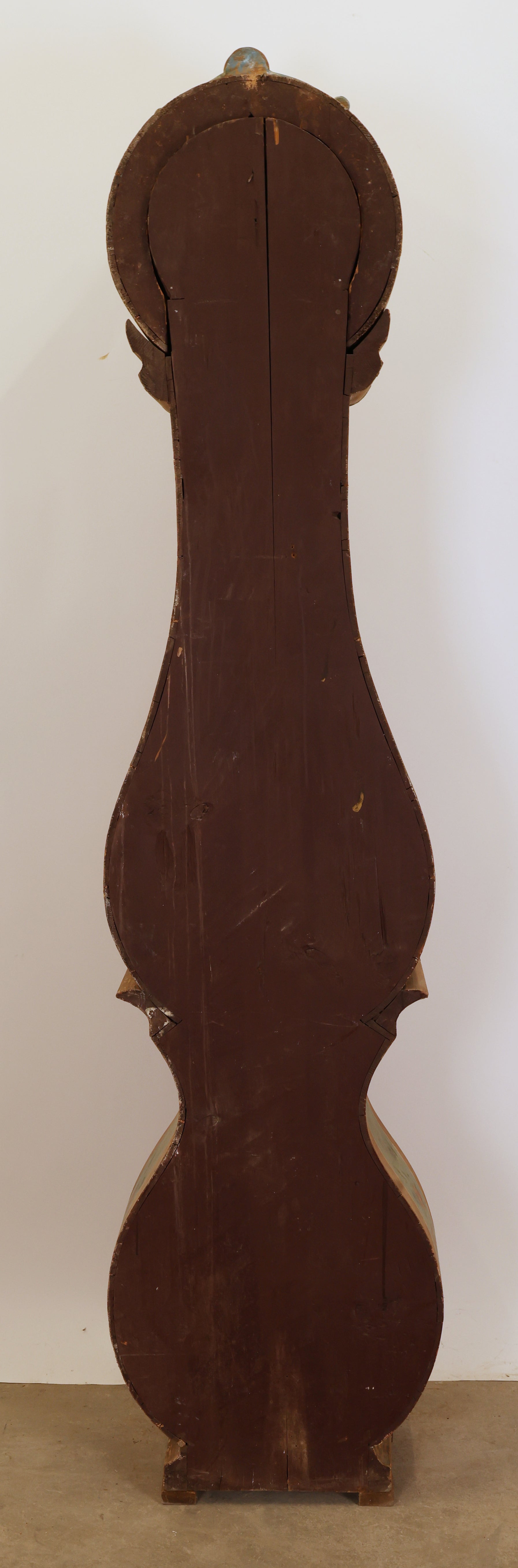 A Swedish antique grandfather clock from behind.