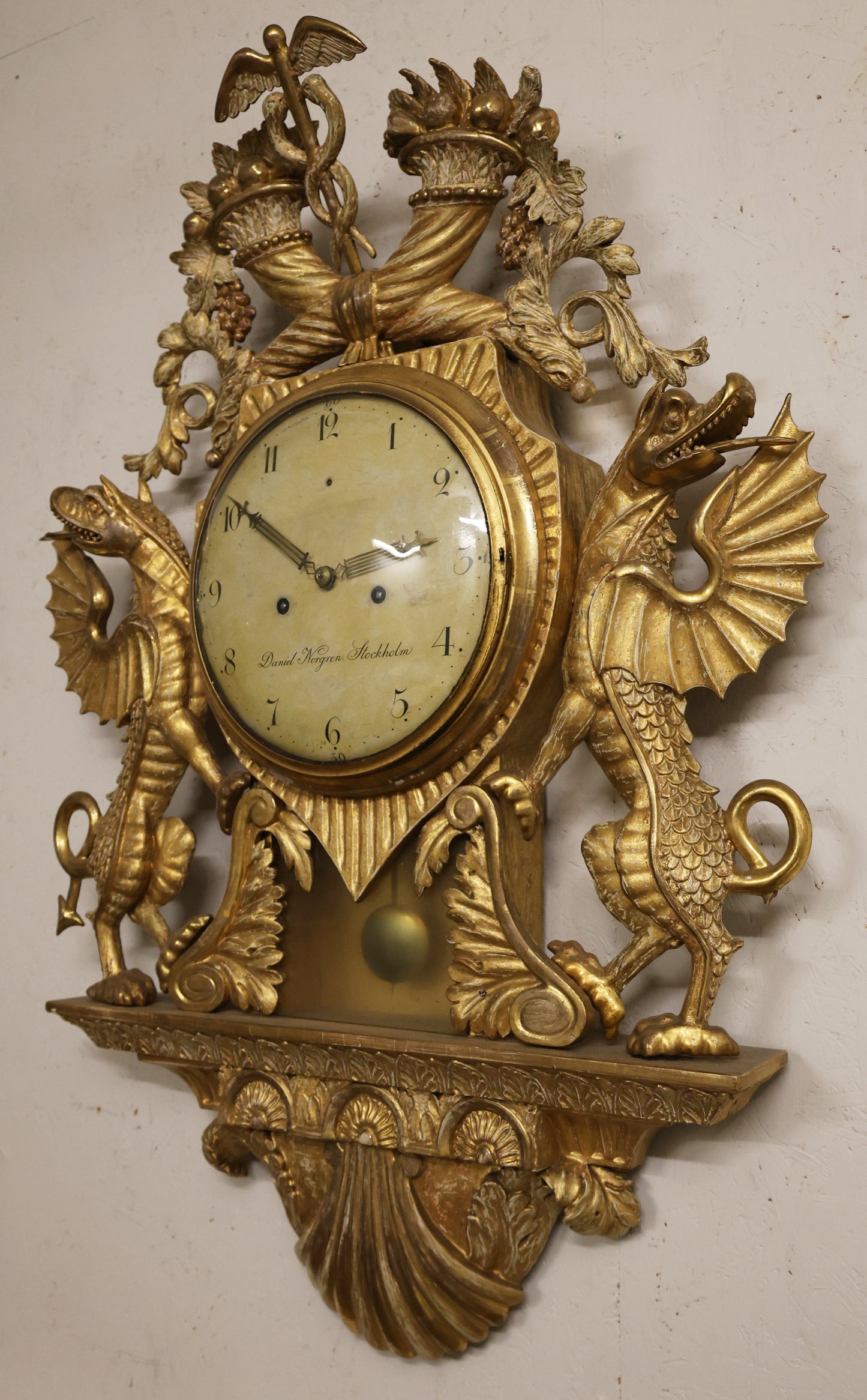 An Empire wall clock made by Daniel Norgren.