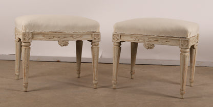 Pair of 18th Century Gustavian Stools signed Johan Erik Höglander with carved decorations of grapes, branches and corner rosettes. The legs are carved with flutings