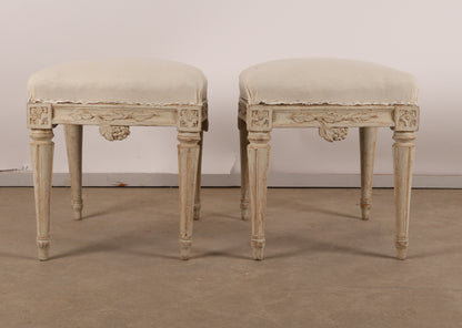 Pair of 18th Century Gustavian Antique Stools signed Johan Erik Höglander with carved decorations of grapes, branches and corner rosettes. The legs are carved with flutings