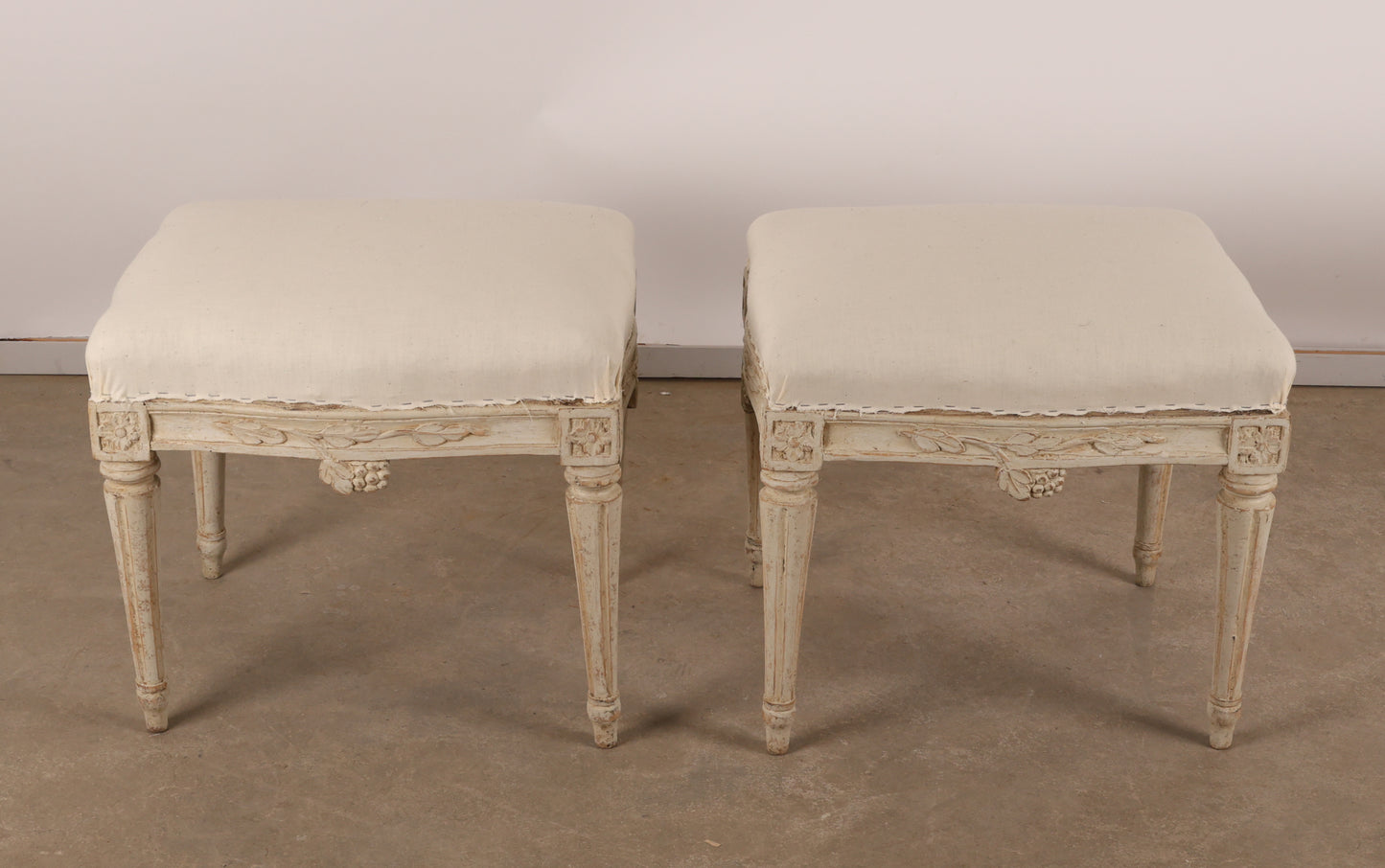 Above view of Pair of 18th Century Gustavian Stools signed Johan Erik Höglander with carved decorations of grapes, branches and corner rosettes. The legs are carved with flutings. 